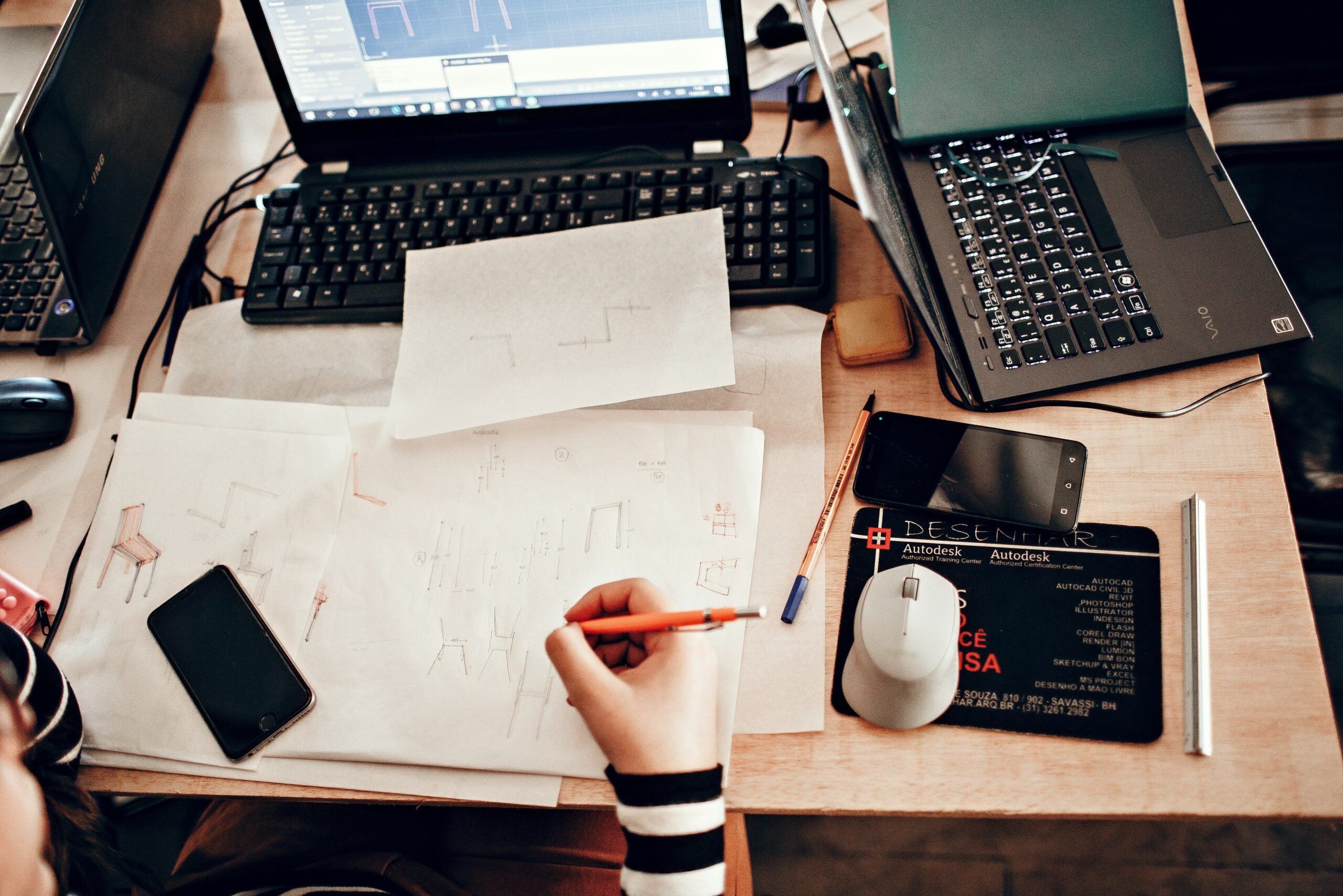 Illustration showing overwhelmed person surrounded by papers and email notifications